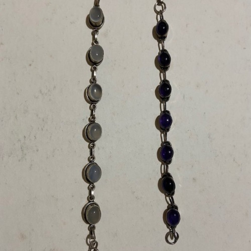- 2 x bracelets - one moon stone and other Amethyst stone both on silver bedding